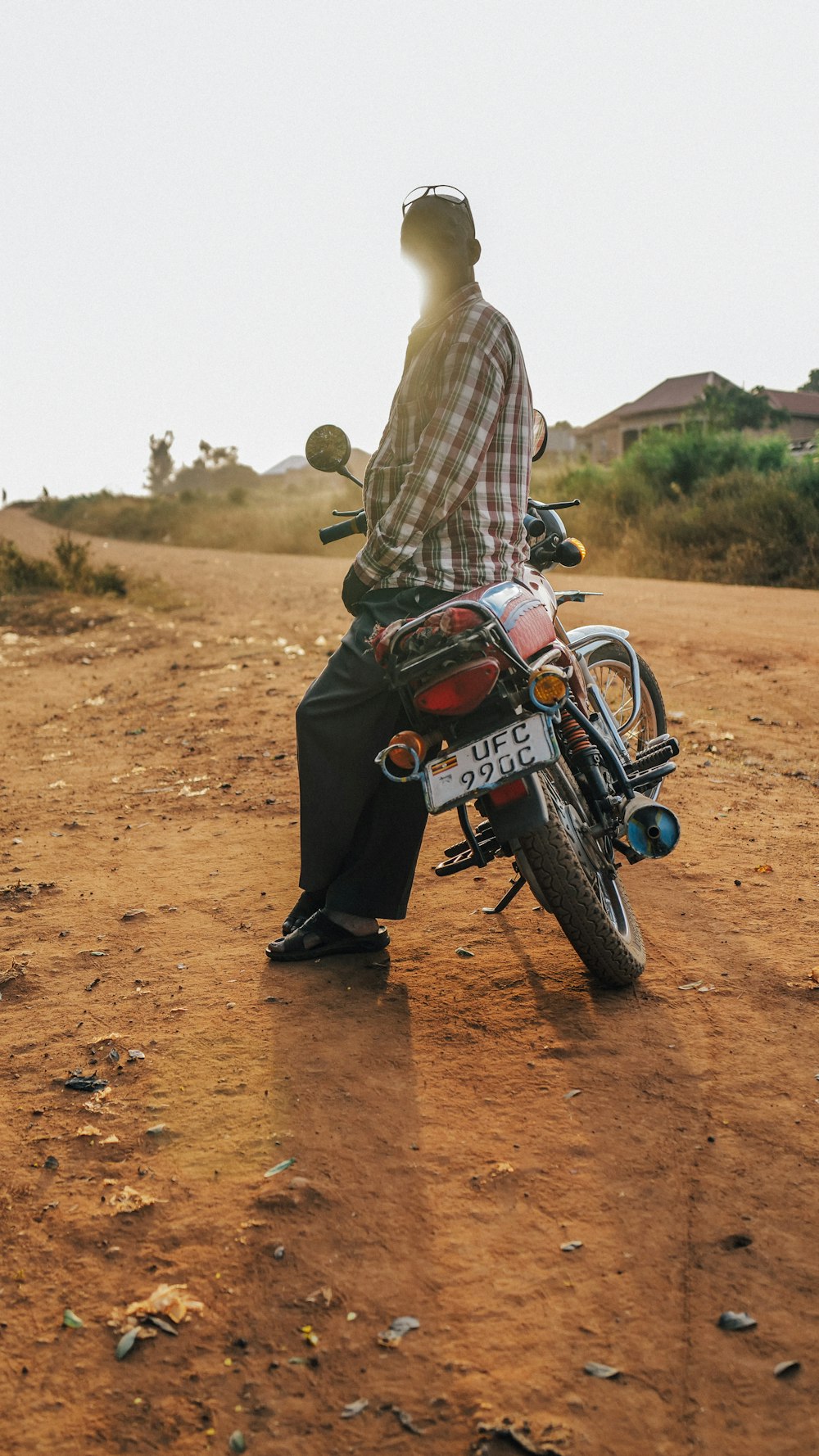 a person standing on a motorcycle
