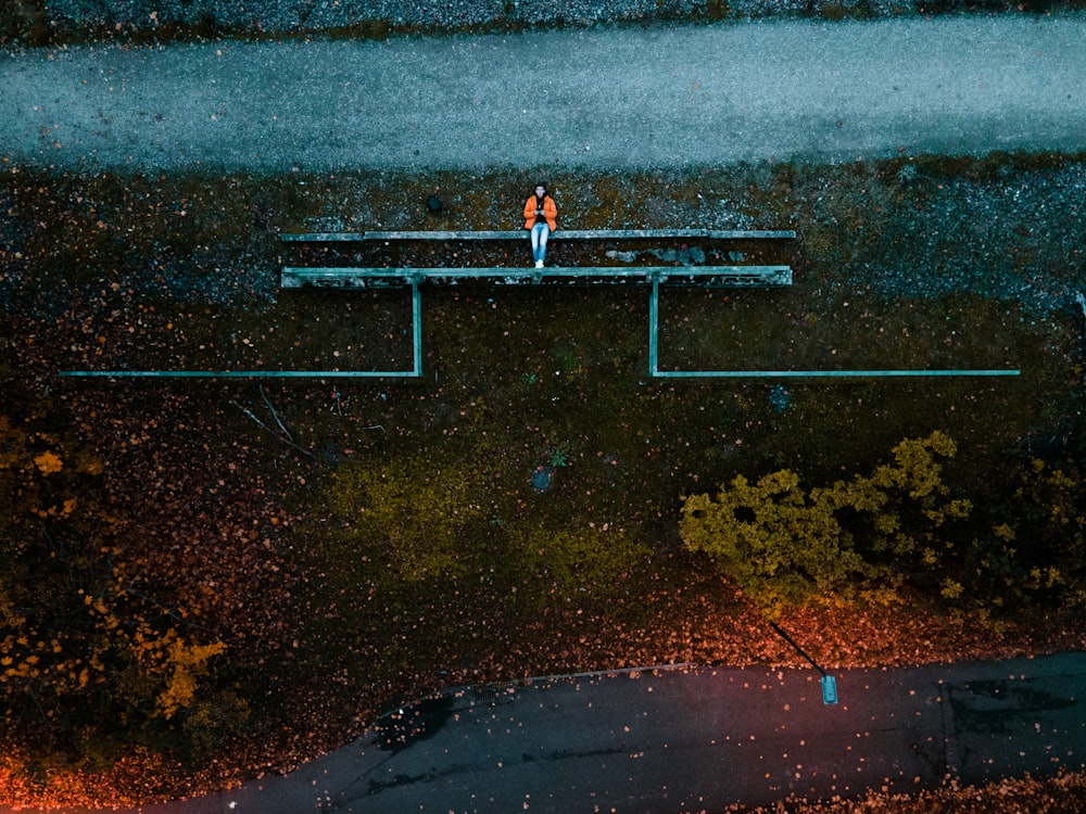 a person standing on a bench