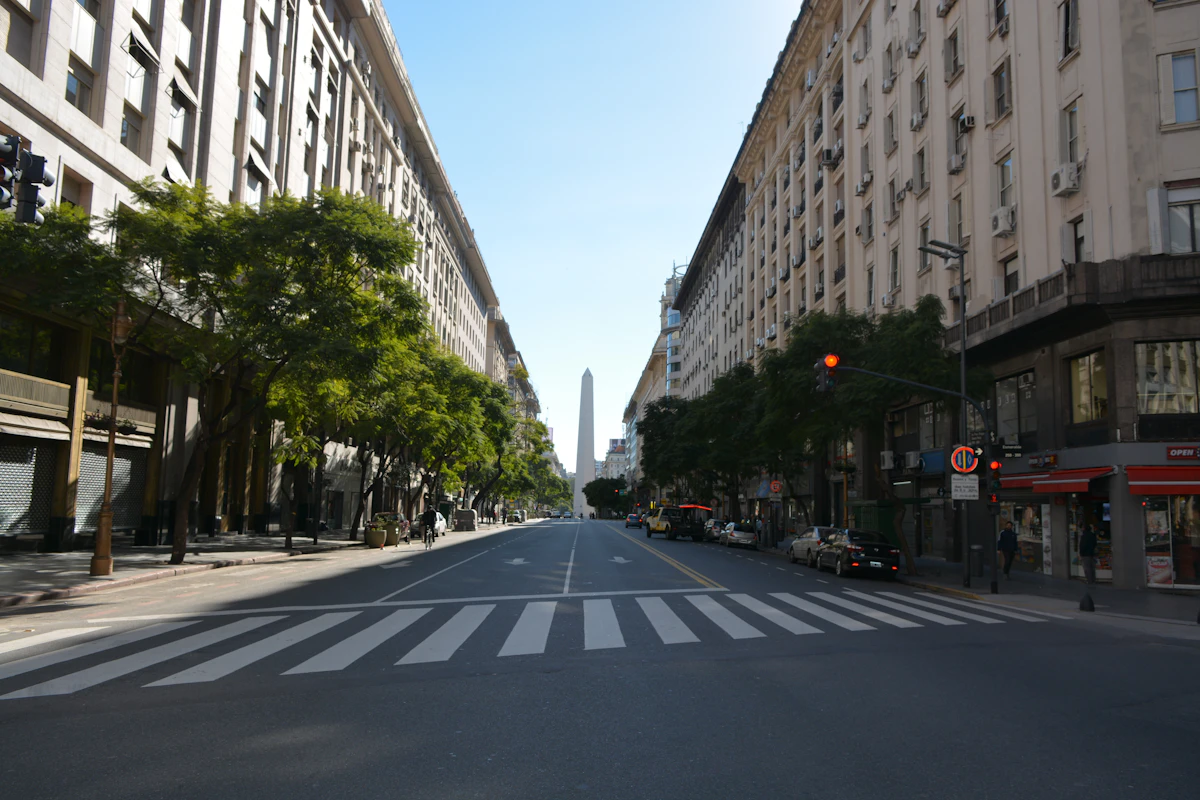 A wide avenue in Buenos Aires lined with tall buildings