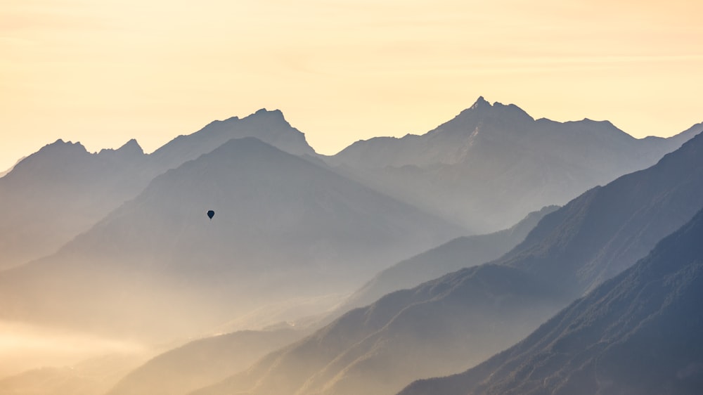 a mountain with a parachute