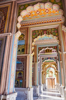 a colorful wall with paintings