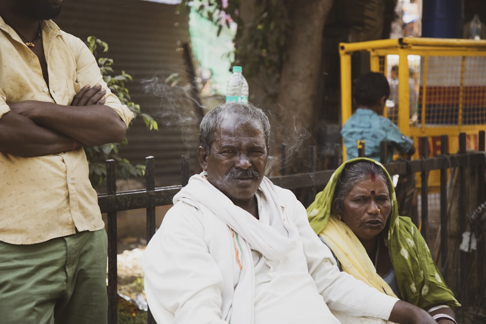 a man and woman sitting on a bench