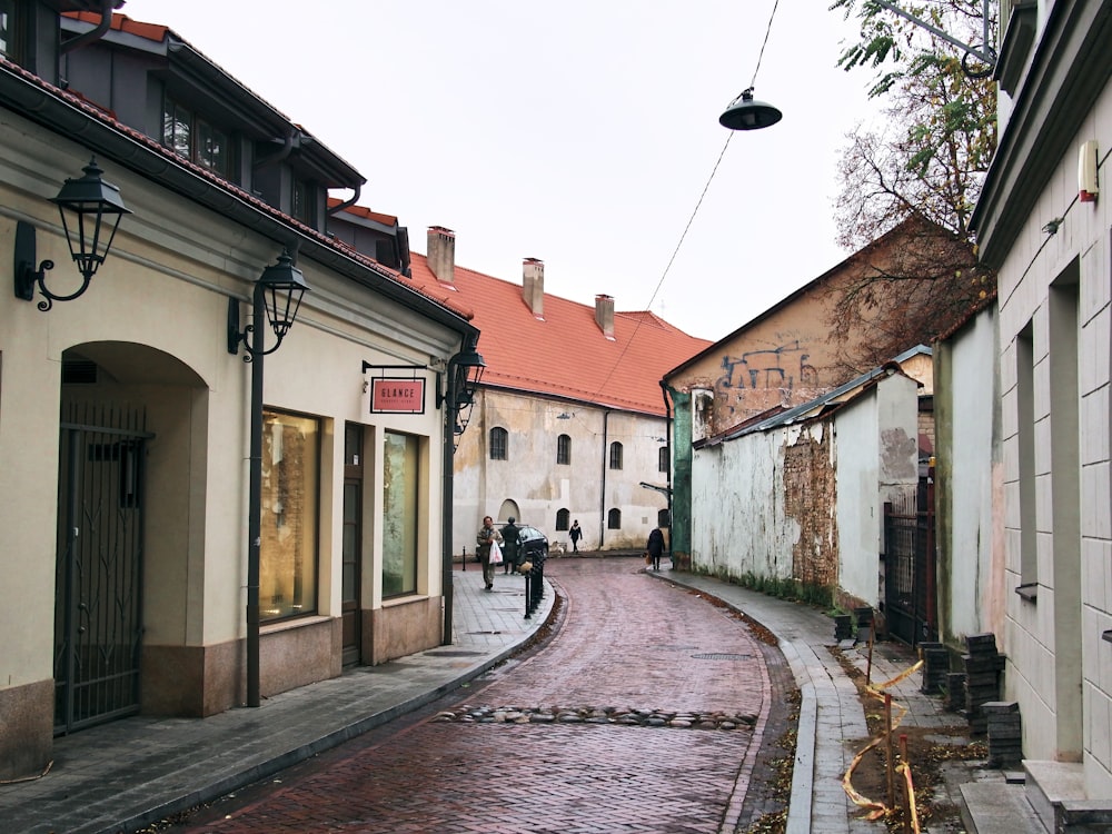 a cobblestone street with buildings on either side of it