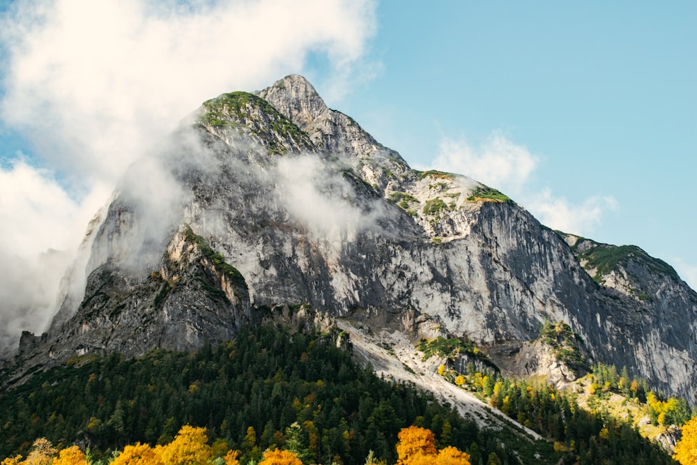 a mountain with a cloud of smoke