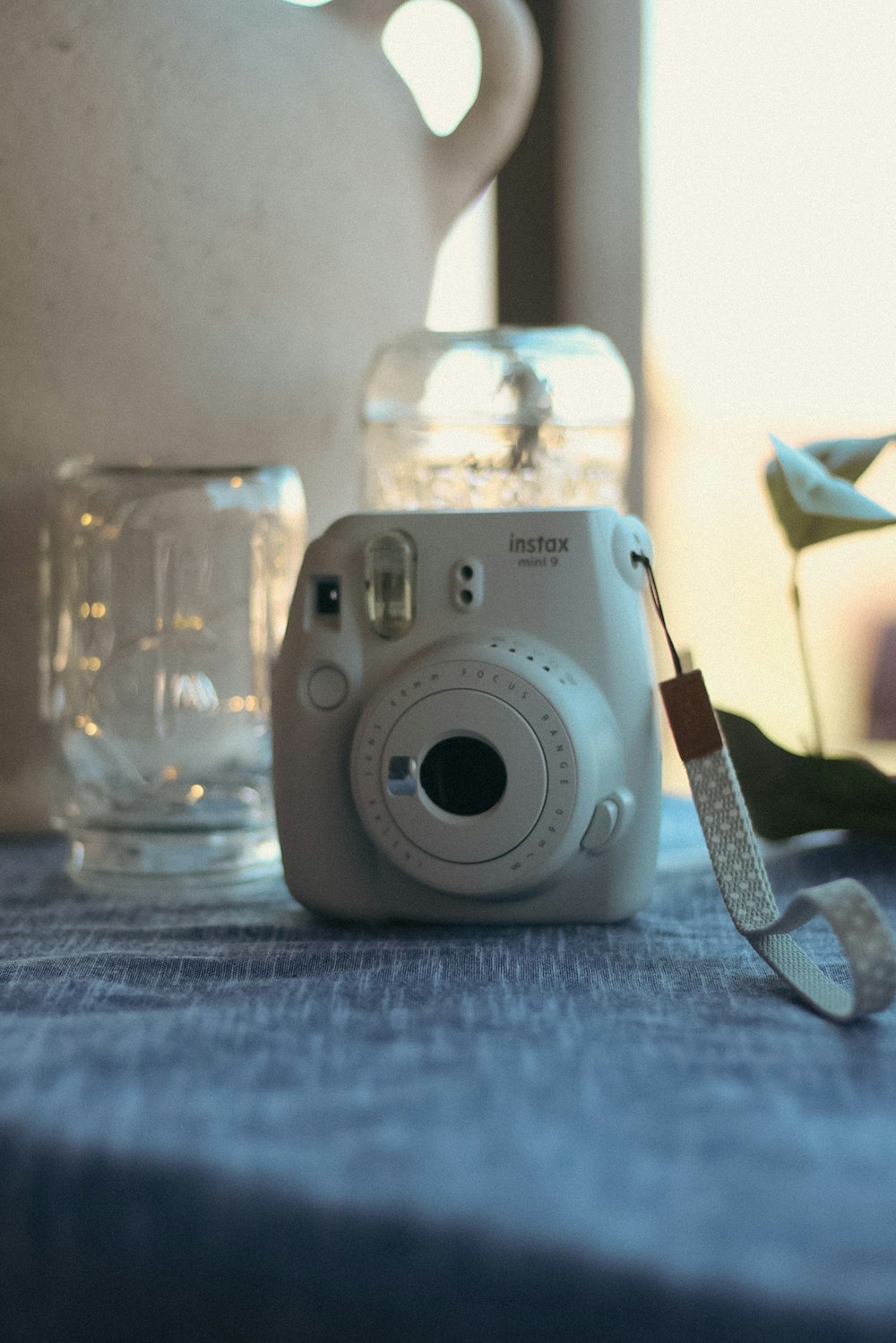 a glass jar with a white lid and a white object in it