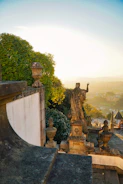 Historic stone staircase surrounded by lush greenery in the Domaine d’Arry park