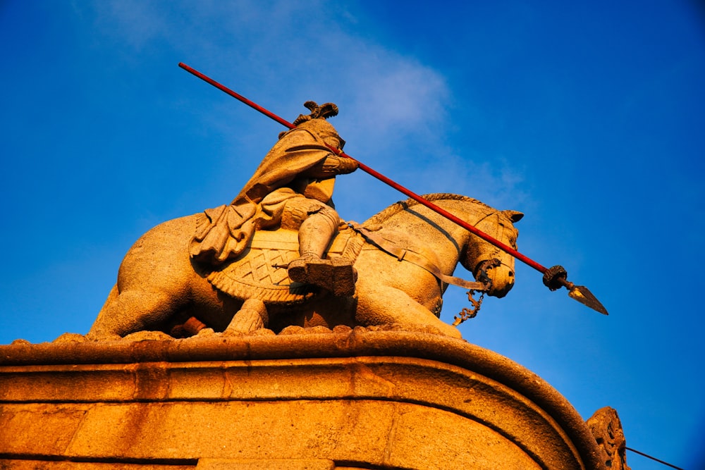 a statue of a person holding a sword