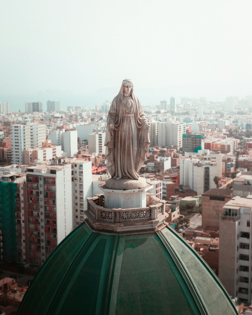 a statue on a roof