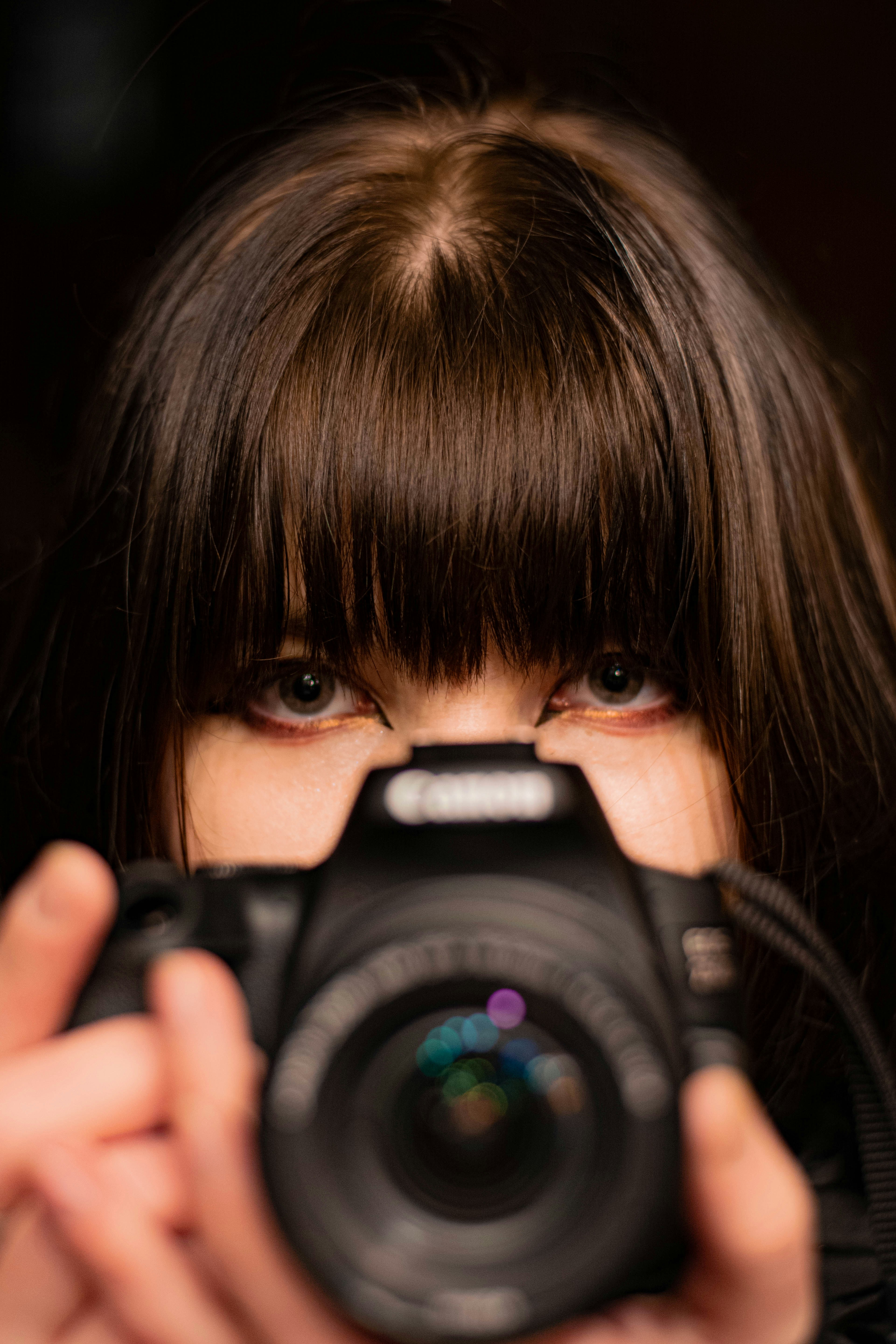 a woman holding a camera