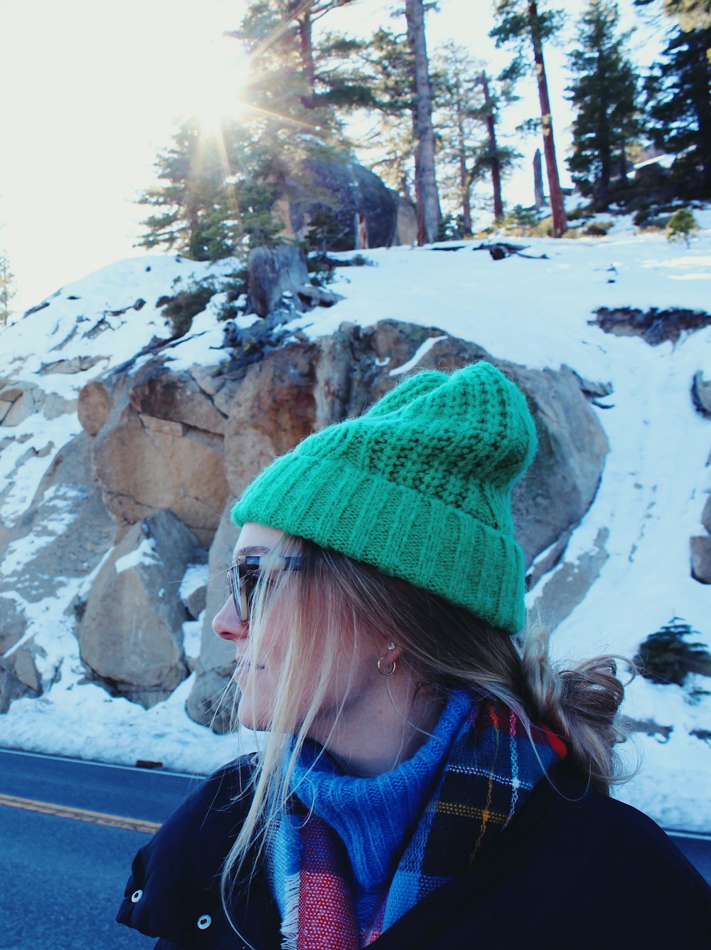 a person wearing a hat and sunglasses