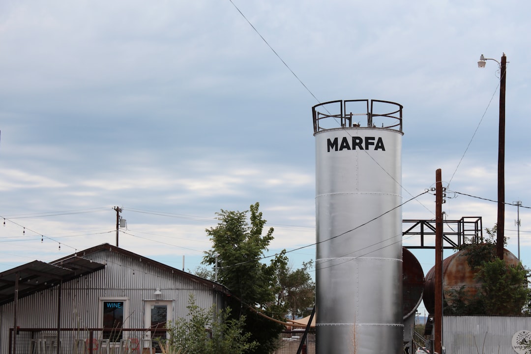 a water tower with a sign on it,