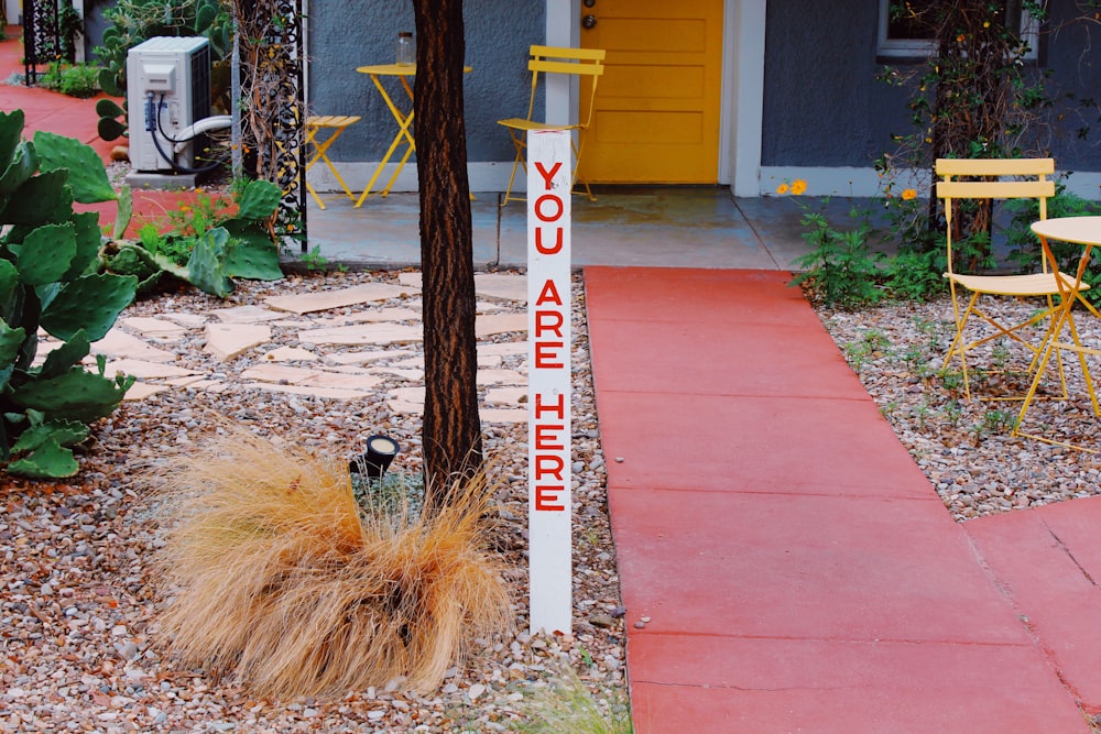 a sign on a sidewalk