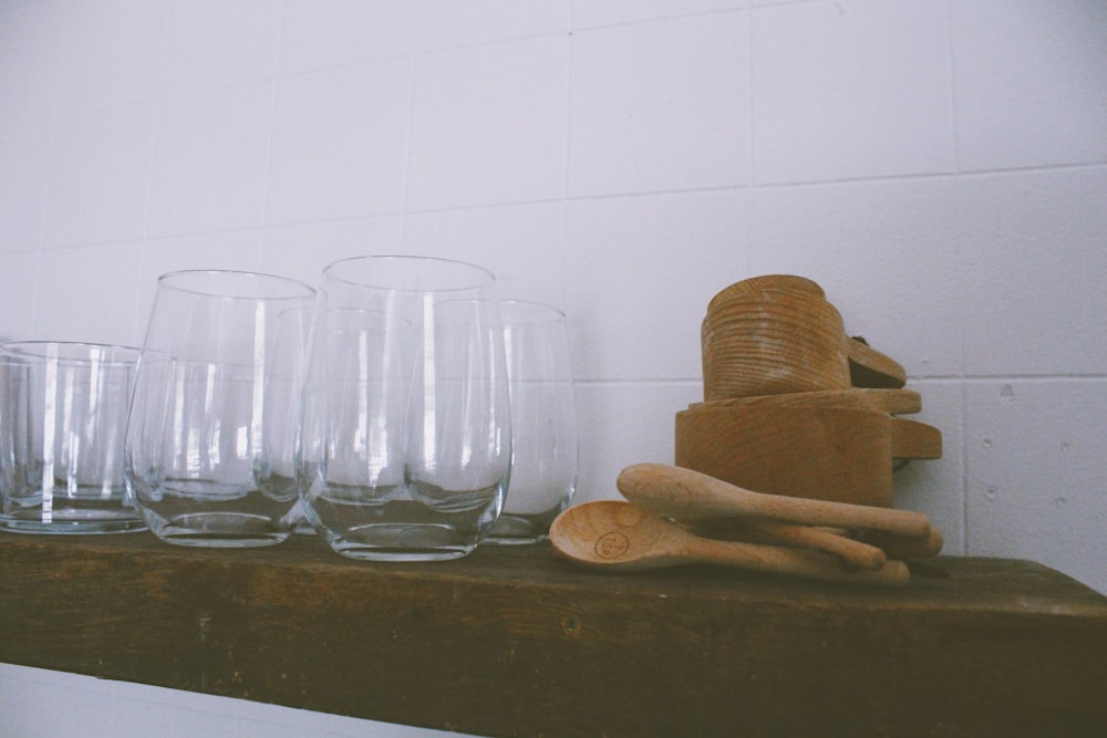 a group of glasses and a rock on a counter