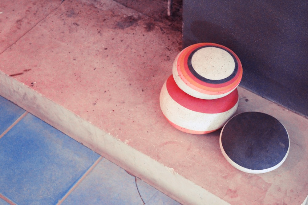 a red bucket on the ground