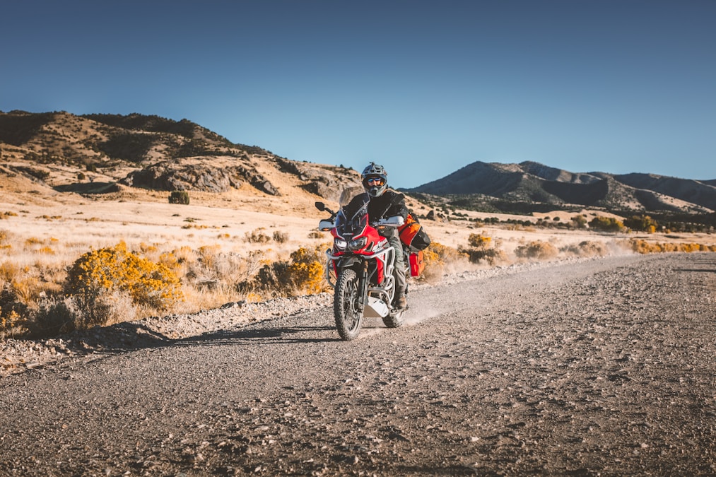 Adventure dual-sport motorcycle on a gravel desert road