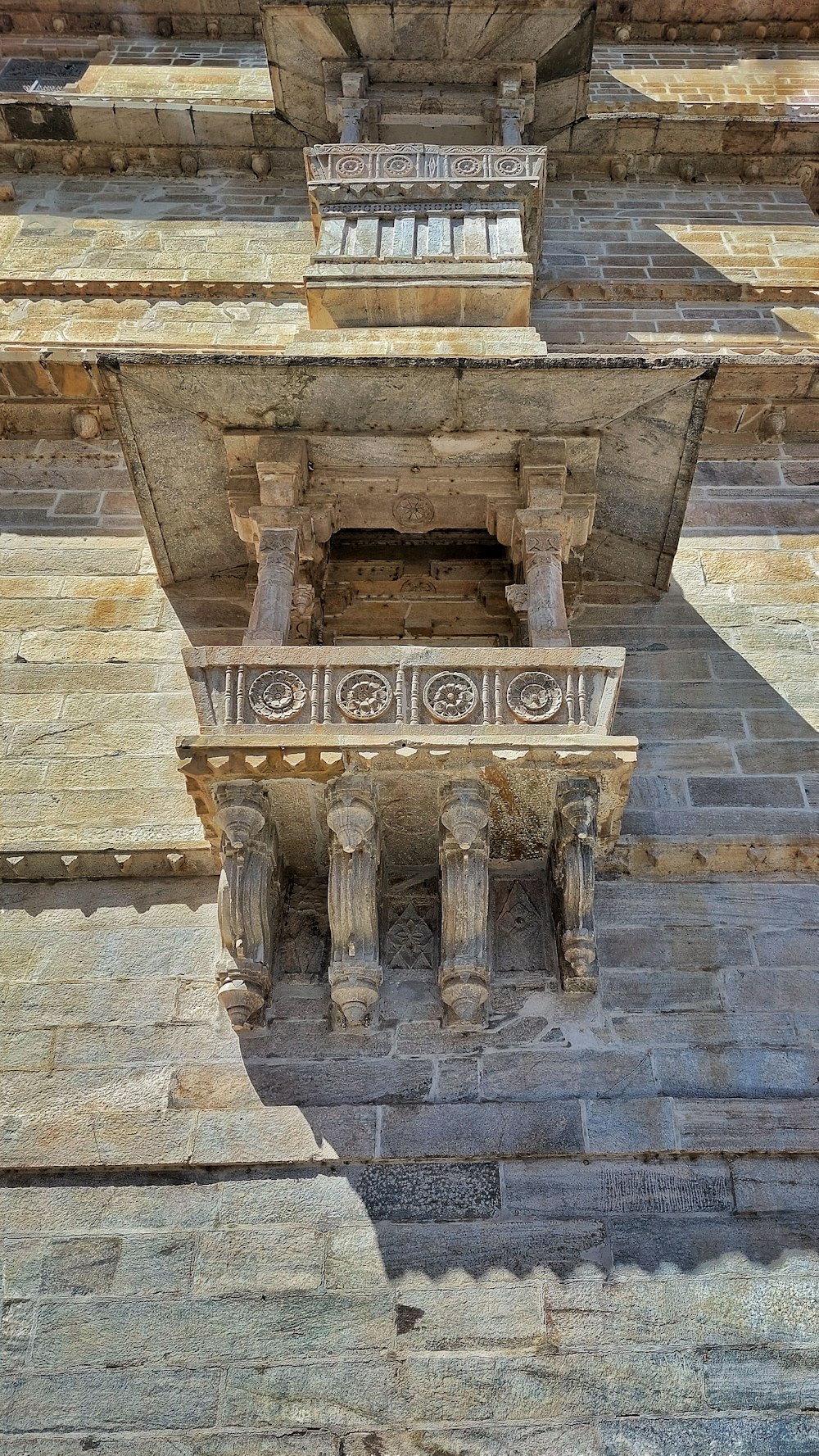 a stone structure with a sign on it