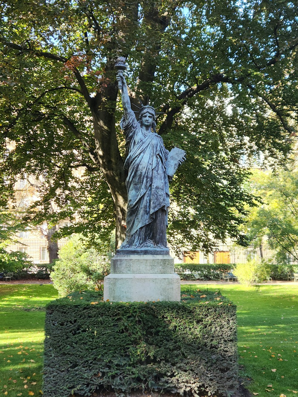 a statue of a person holding a torch
