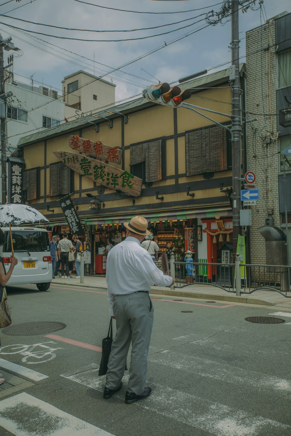 a man stands in the middle of a street