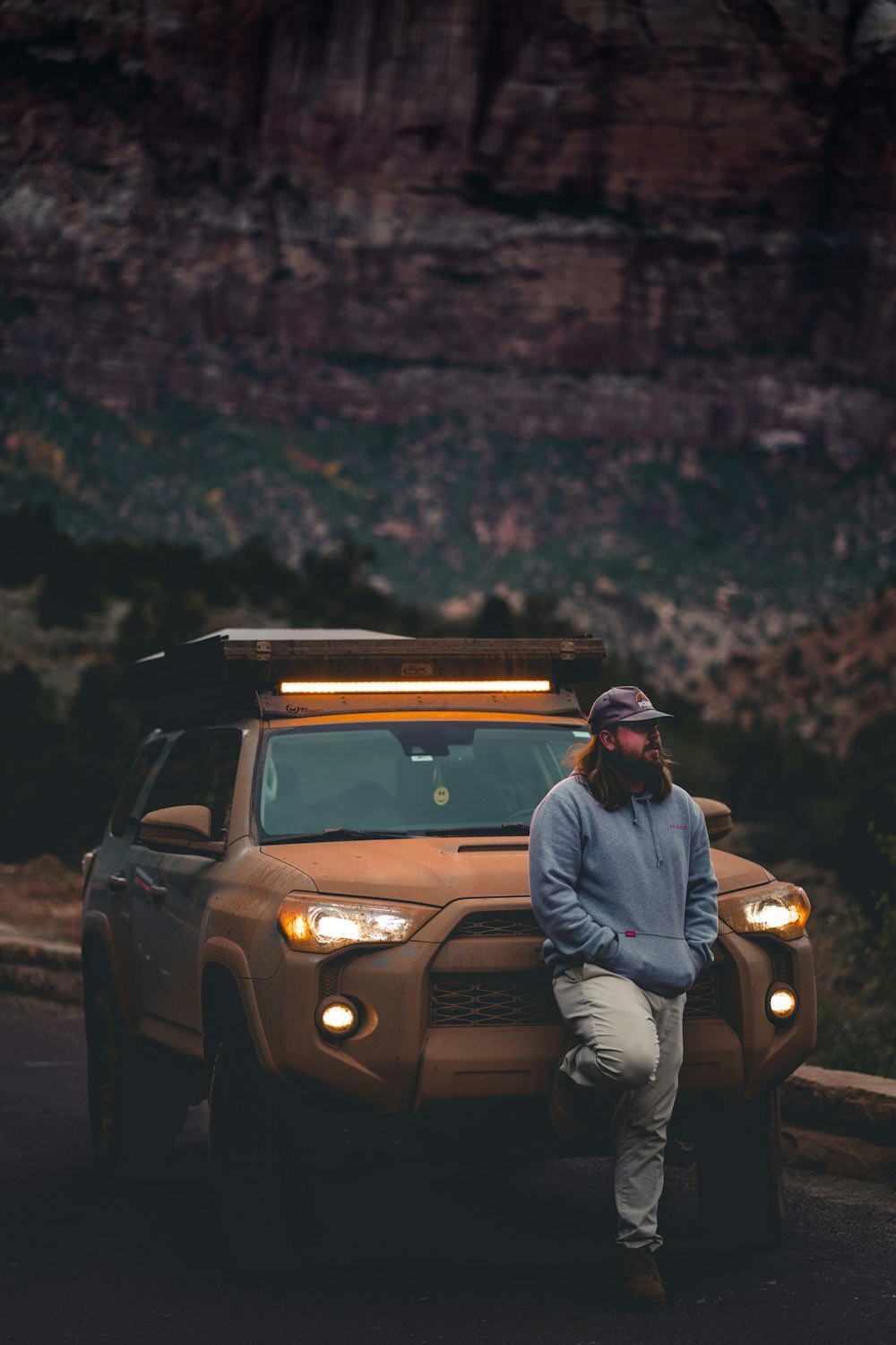 a man standing next to a car