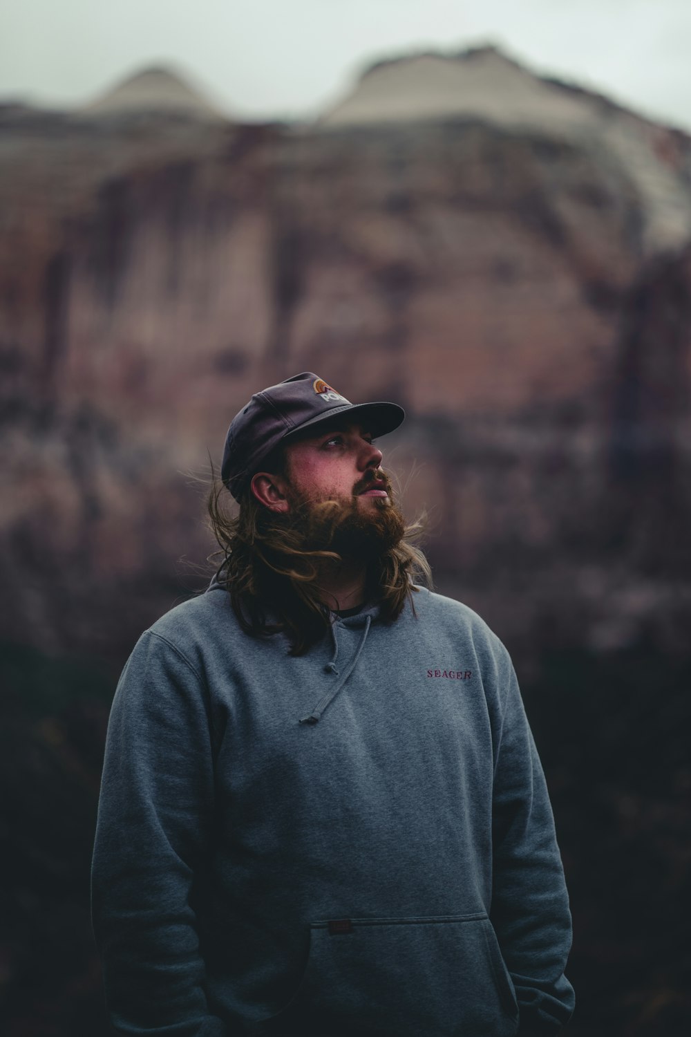 a person with a beard and hat