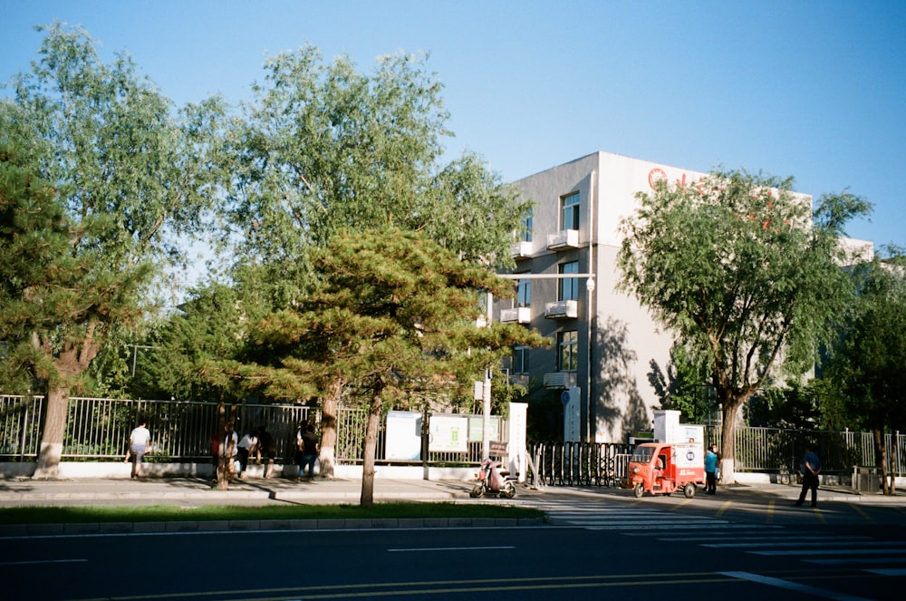 a street with trees and a building