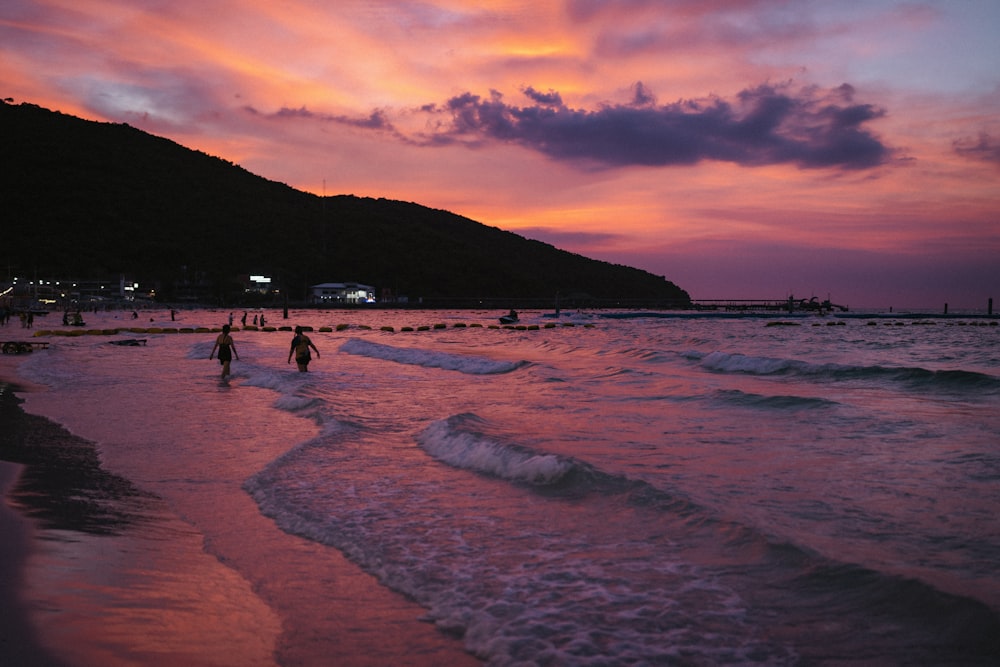 people walking on a beach