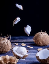 Close-up of fresh coconut shells and a scoop of natural cascinha ice cream