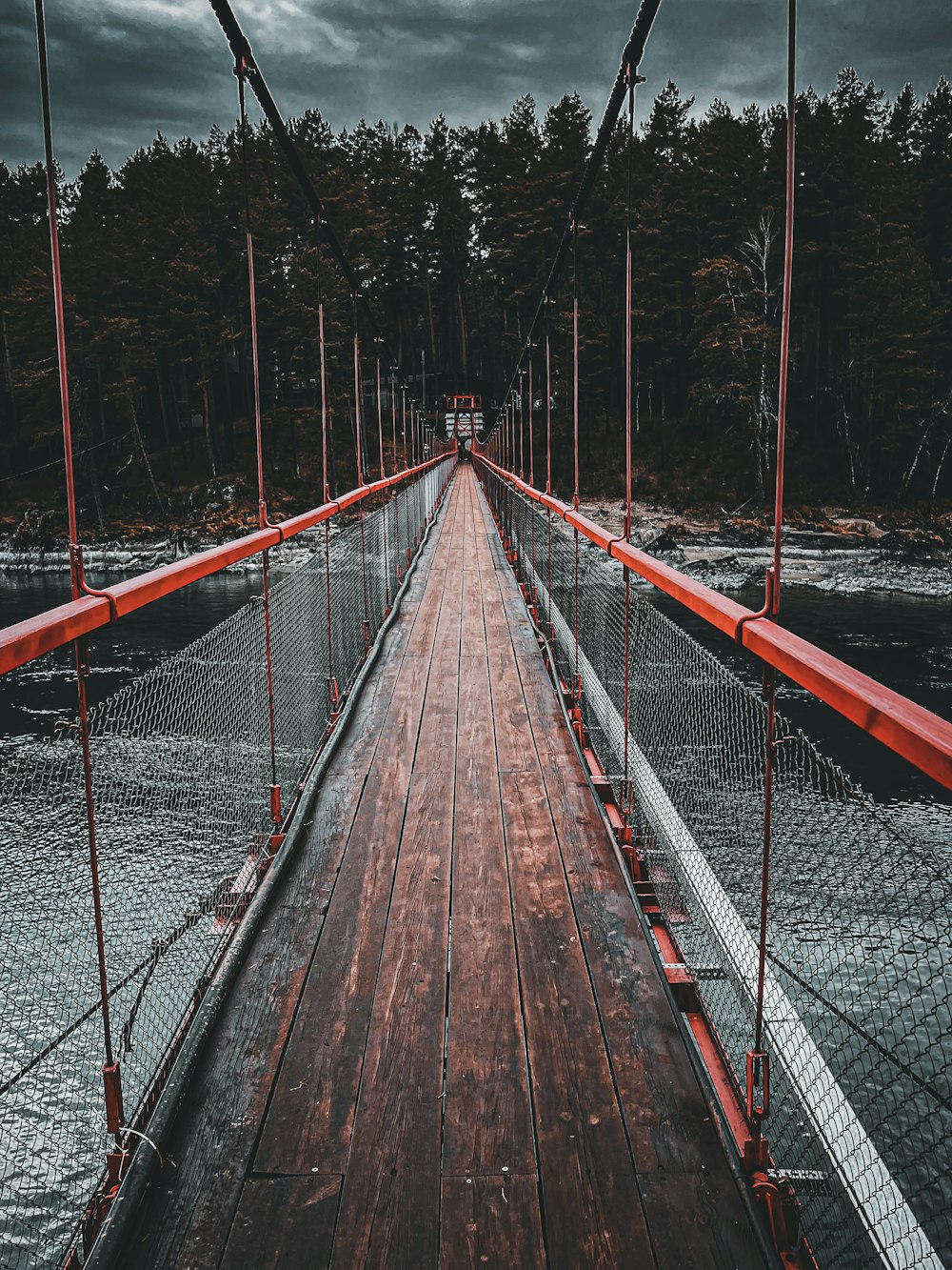 a bridge with red ropes