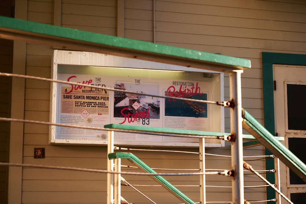 a sign on a railing