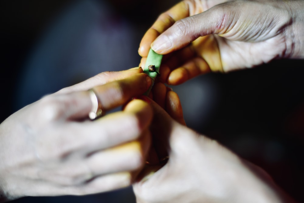 a person holding a green object