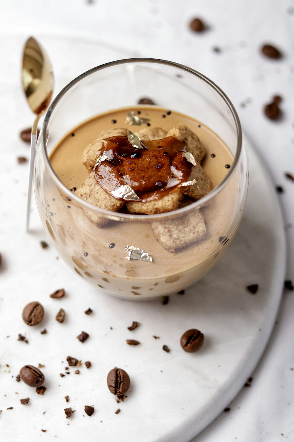 a cup of coffee with coffee beans