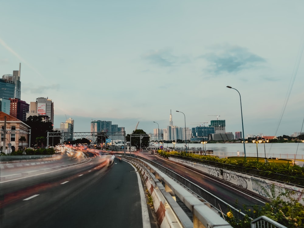 a road with a city in the background