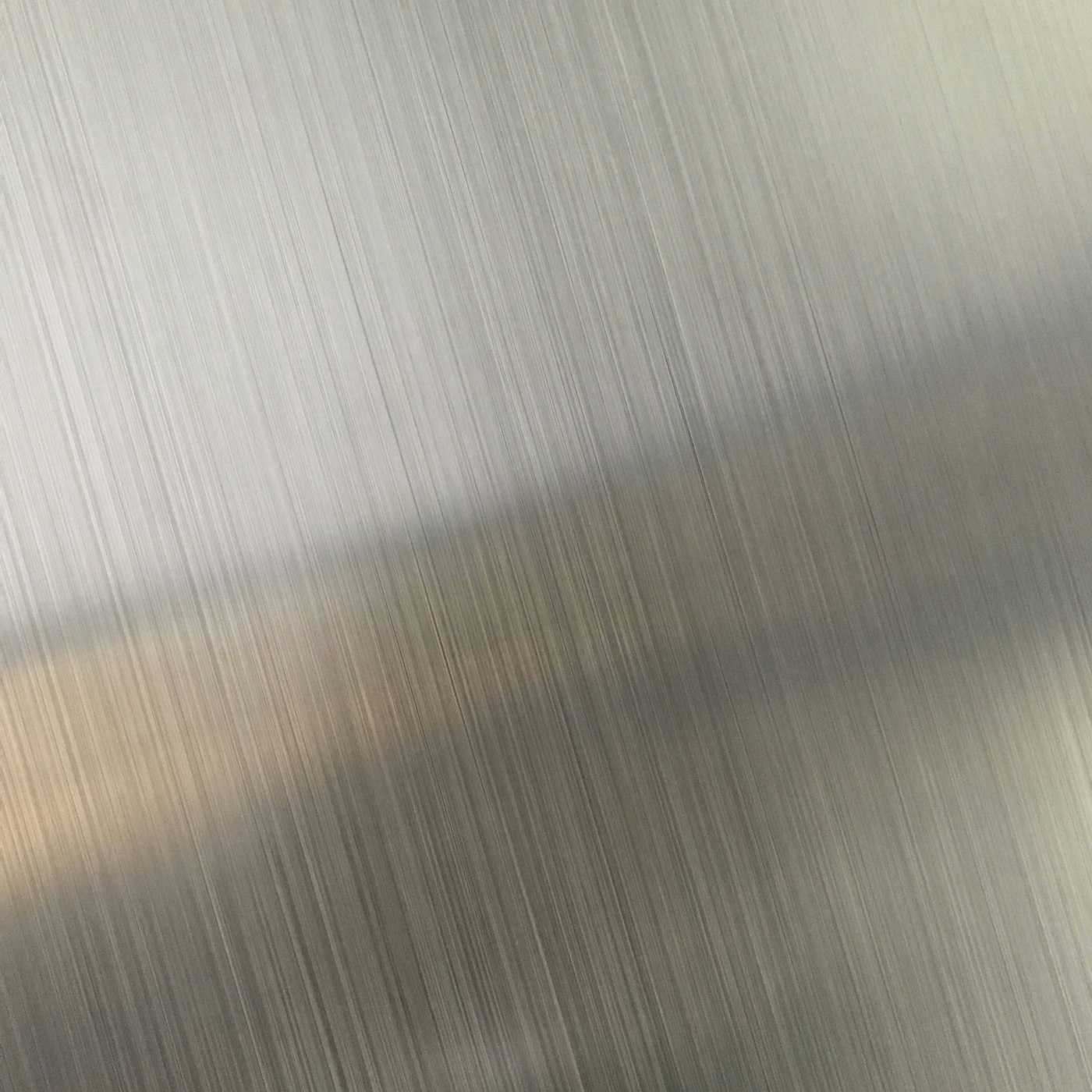 Brushed and polished stainless steel surface