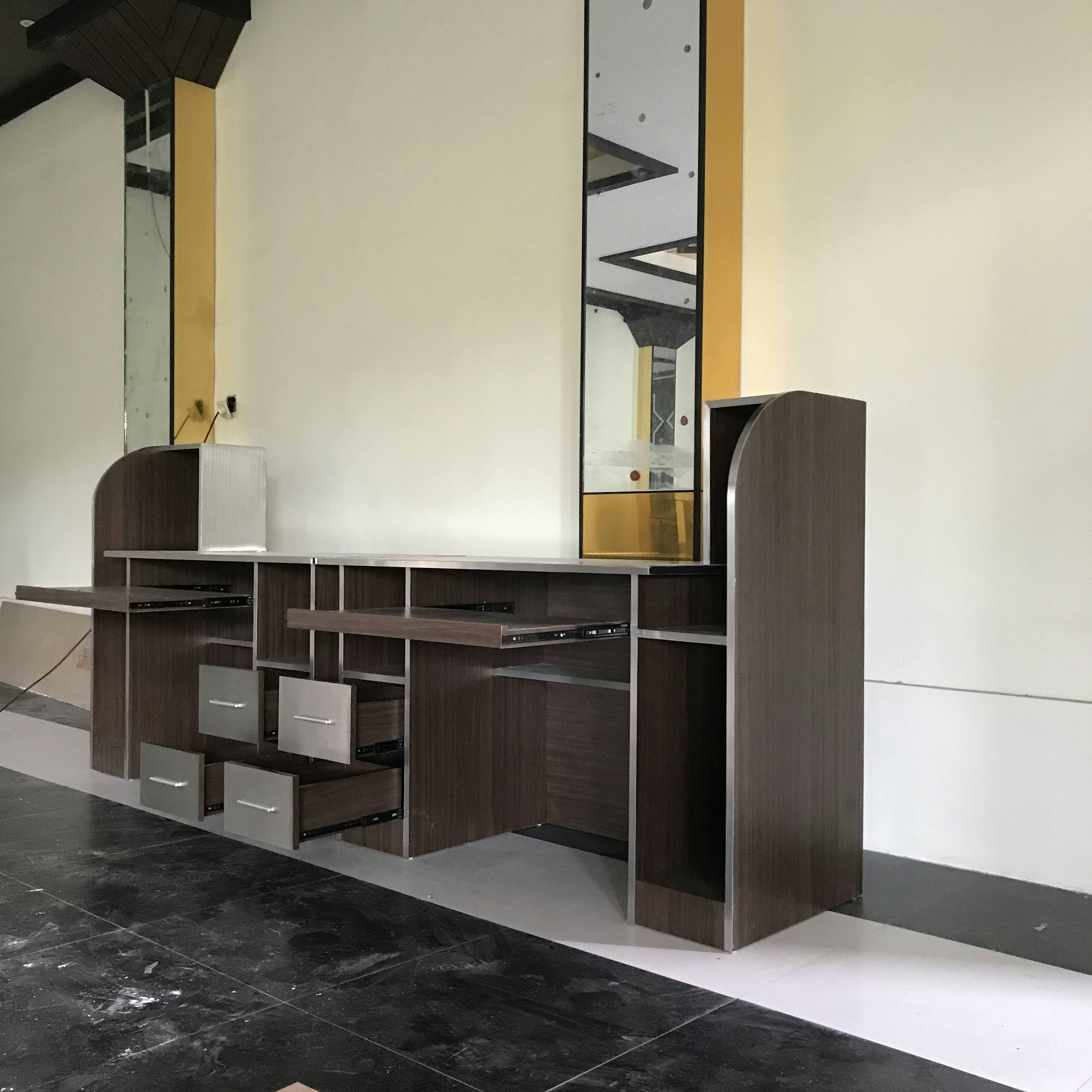 a room with a large white wall and a black floor