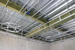 a large room with a few people