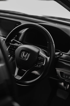 Close-up of a 2019 Honda's sleek dashboard and steering wheel.