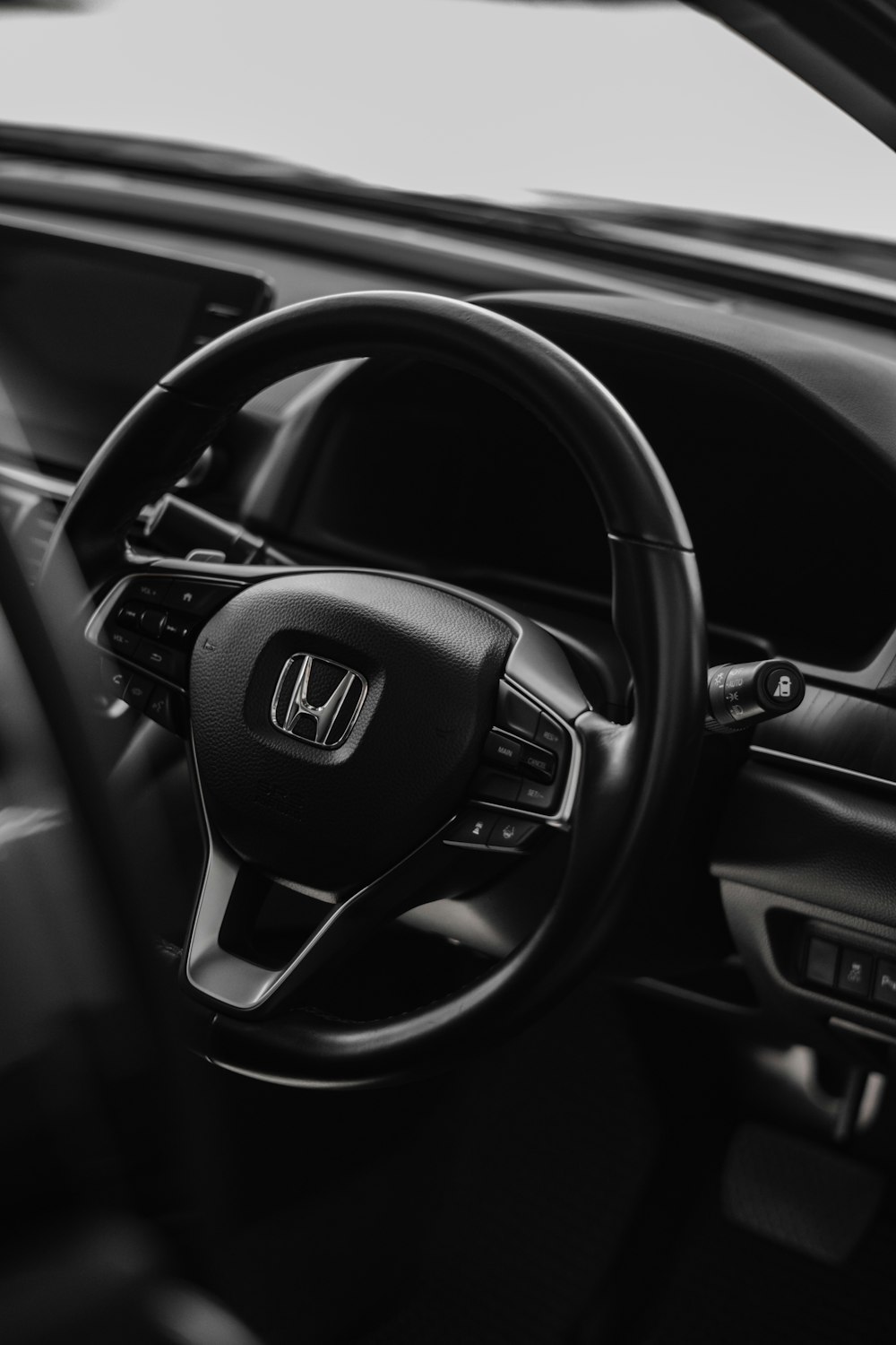 a steering wheel and dashboard of a car