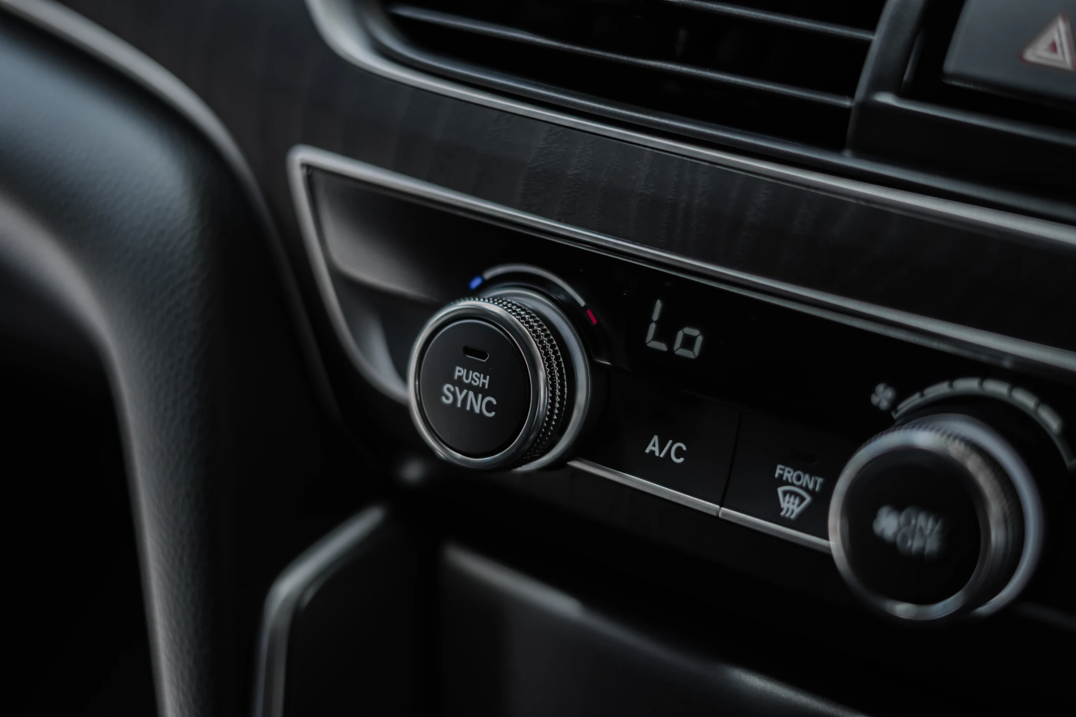 Close view of a clean modern car dashboard and center console