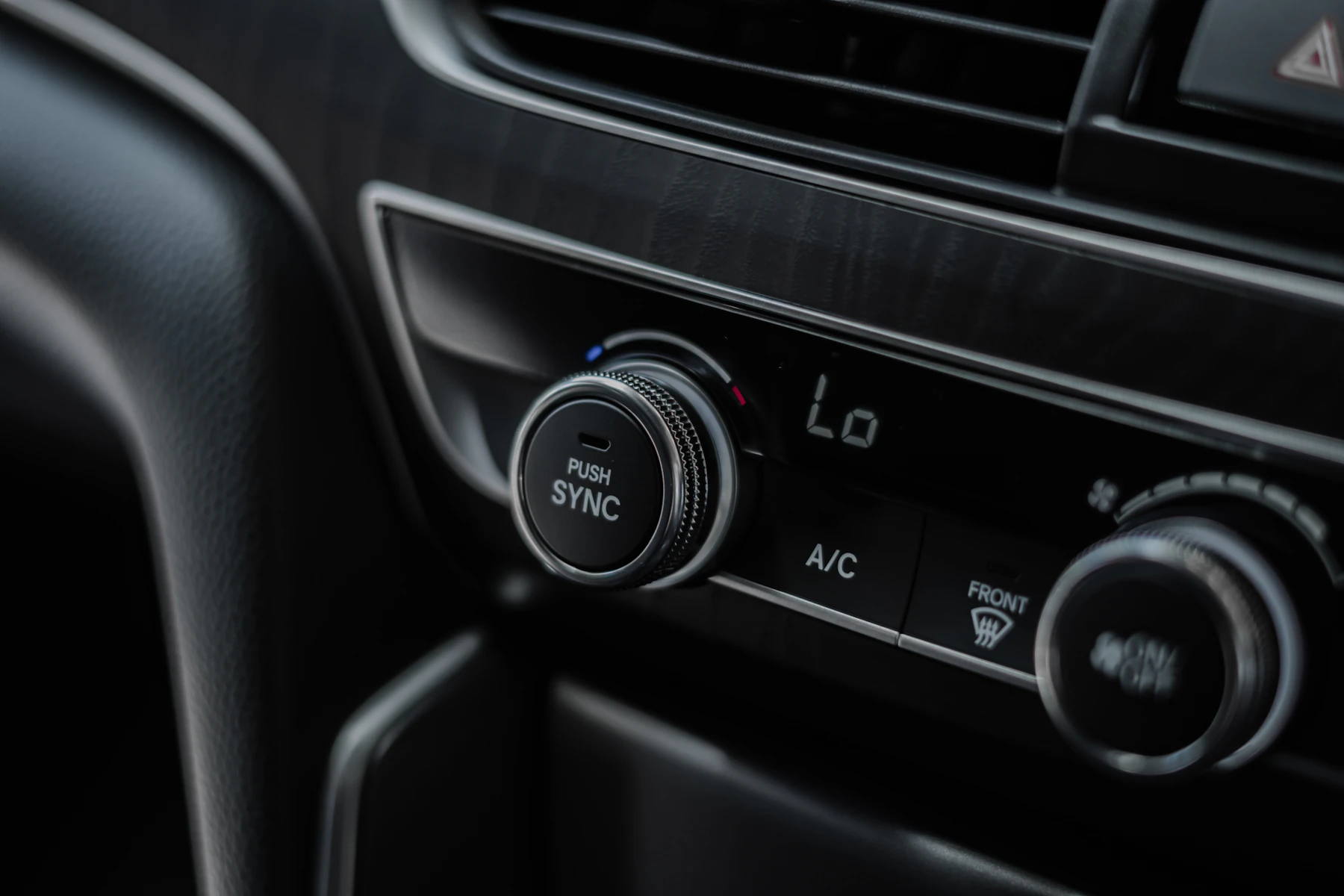 Dark modern car dashboard and interior representing comfortable everyday driving