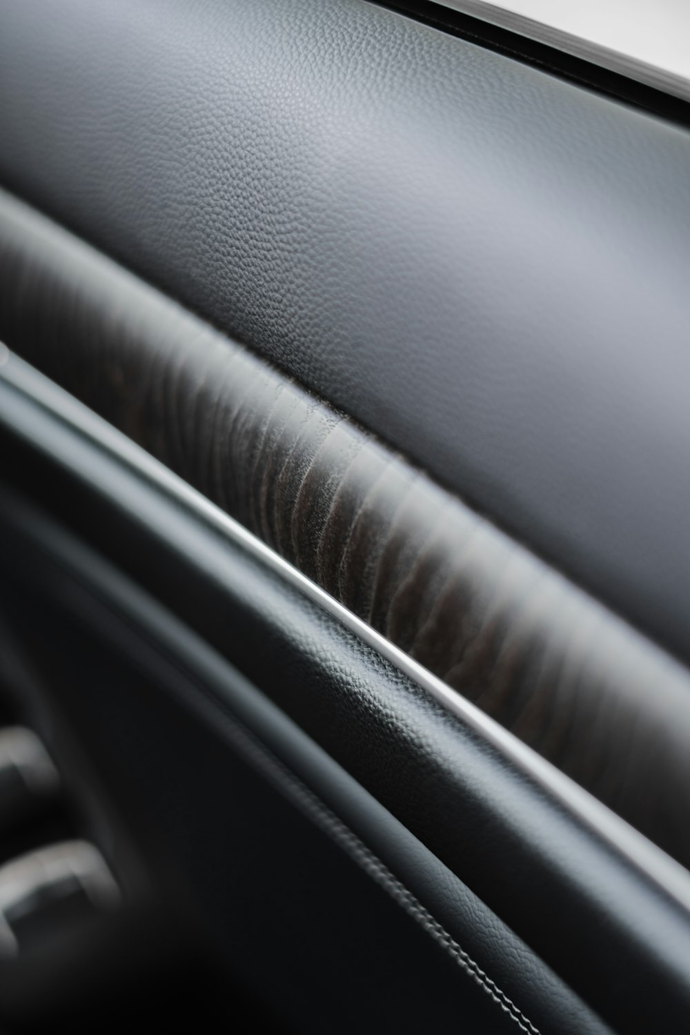 a close up of a black leather surface