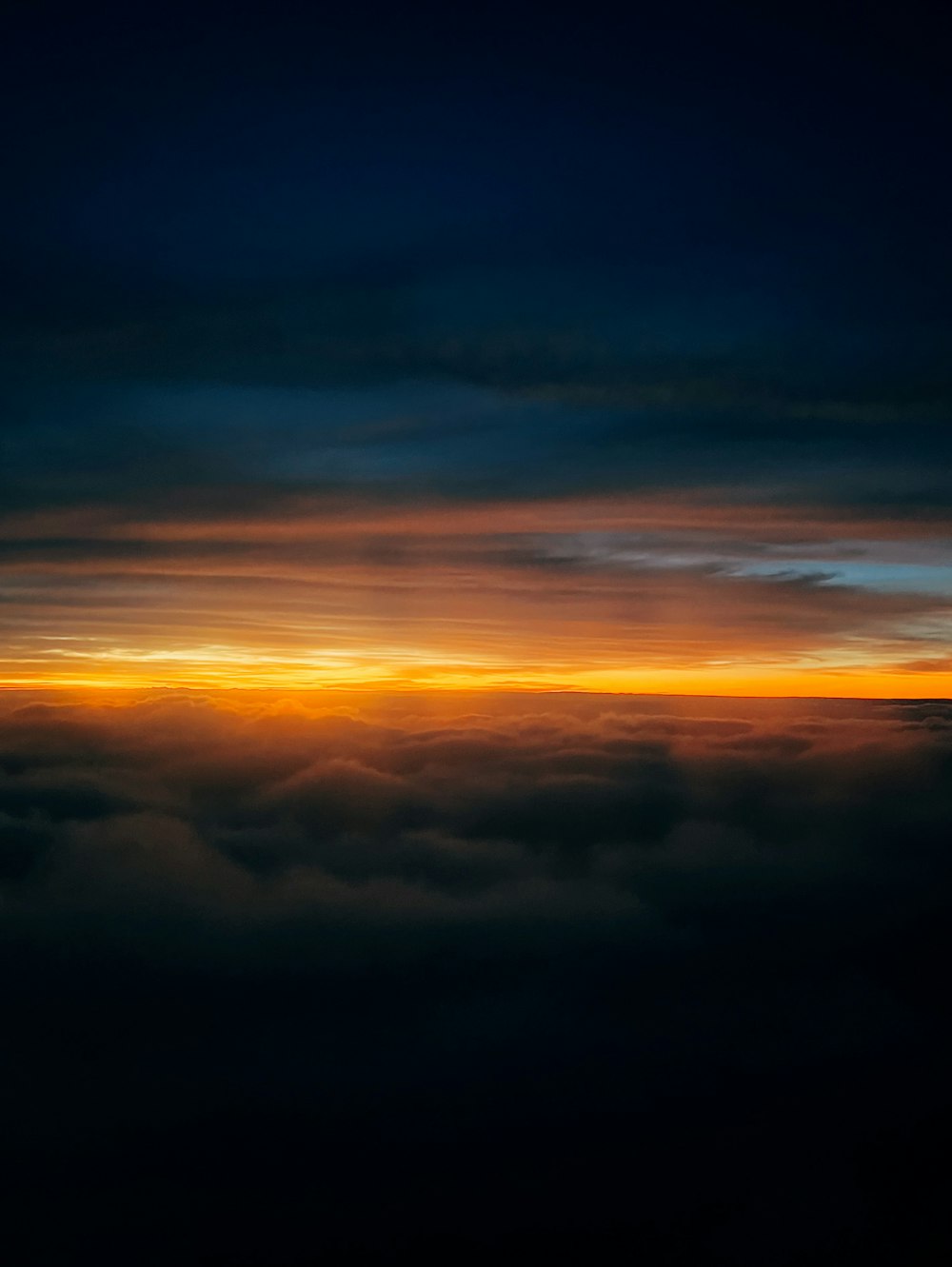 a view of the sun and clouds