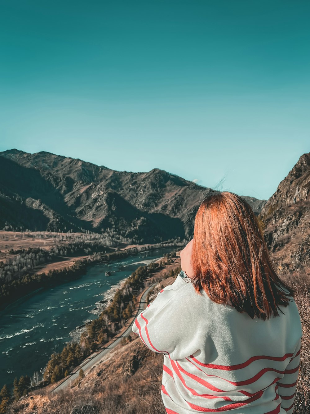 a person looking at a river