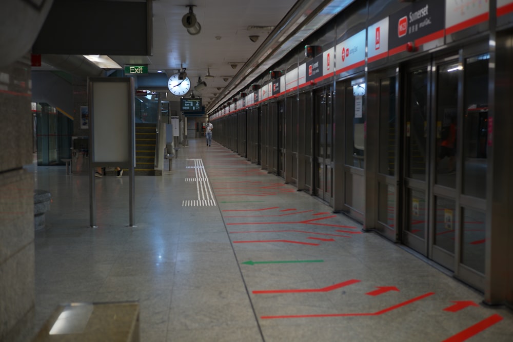 a train station with a person walking