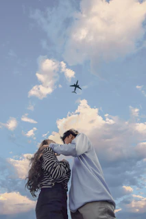 An emotional moment of a couple sharing a quiet smile during their romantic proposal flight.