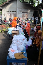 Volunteers organizing supplies for community activities near the mosque