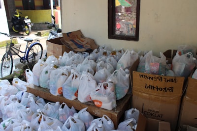 Open pallet loaded with mixed general merchandise including toys, clothing, and household items.