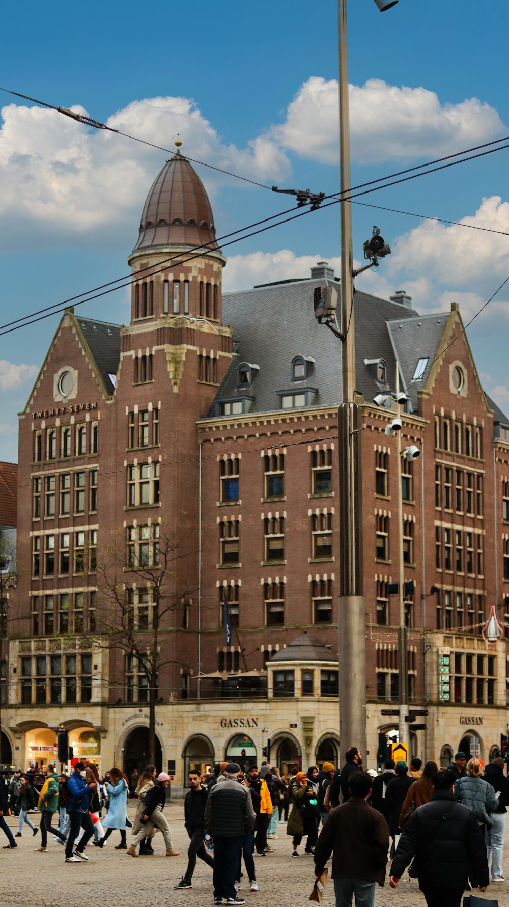 a group of people walking outside of a building