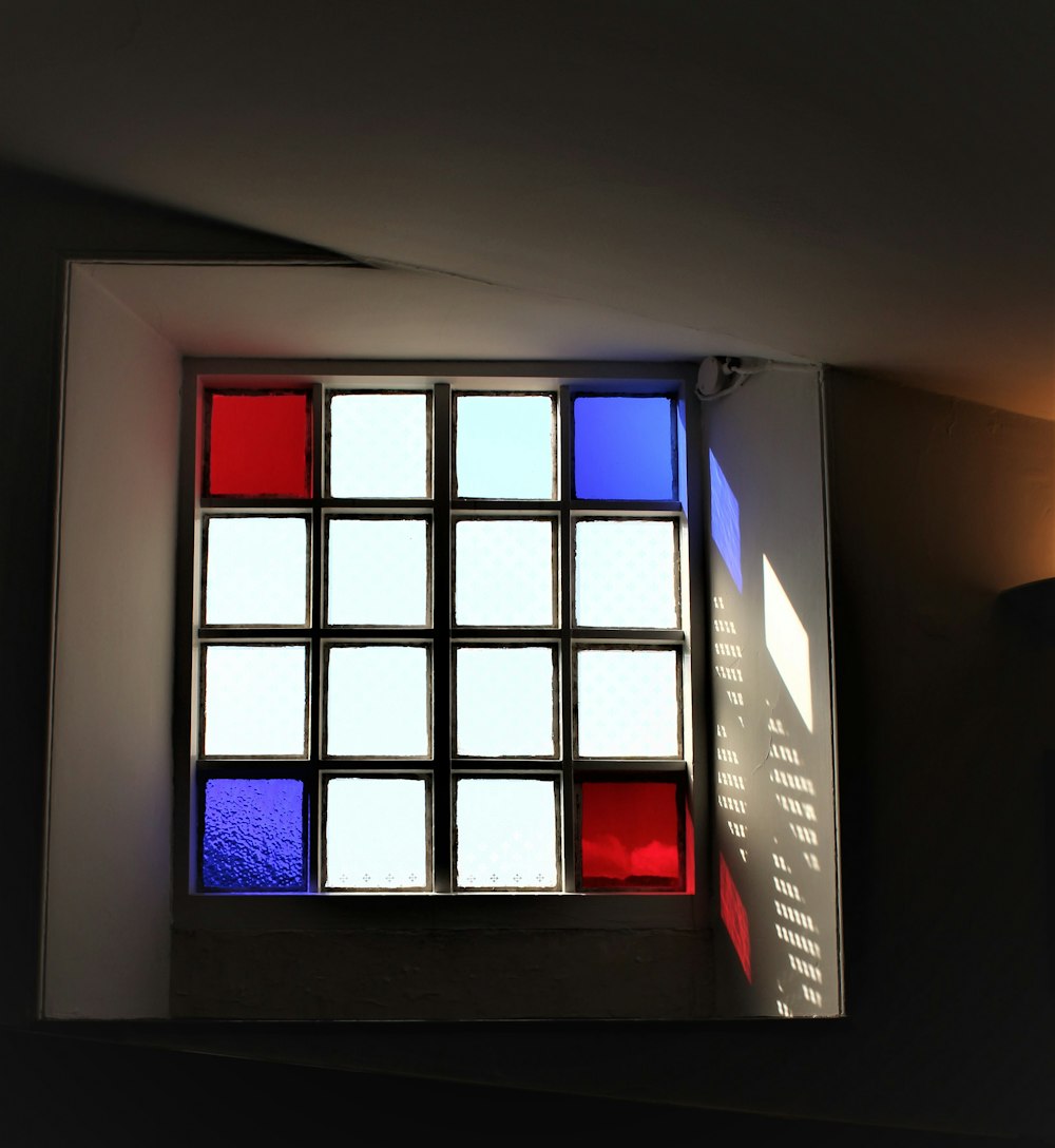 a window with a red and blue light