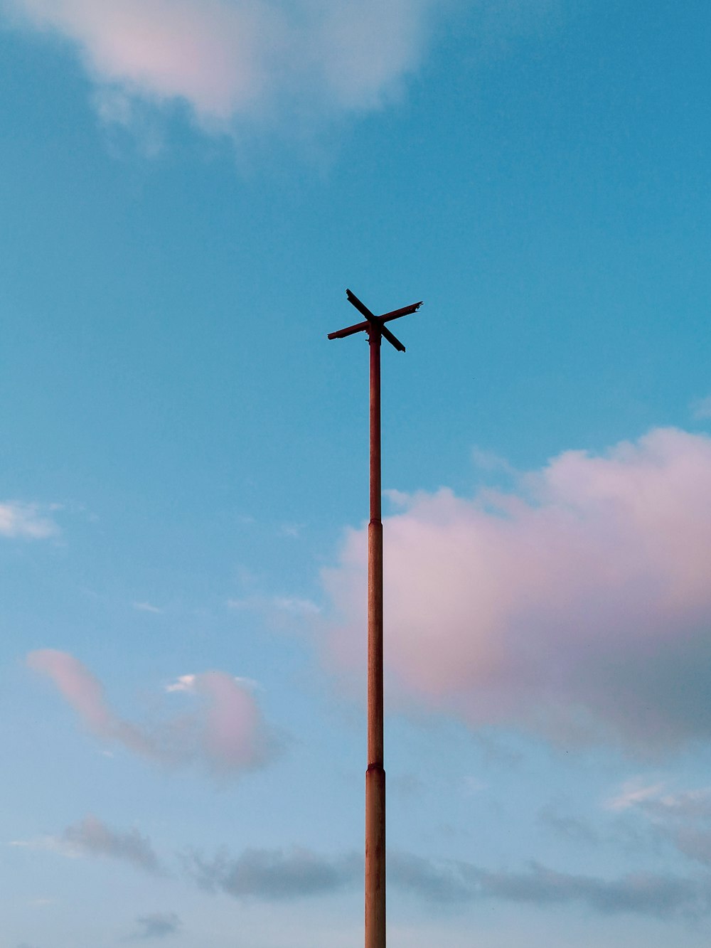 a pole with a cross on it