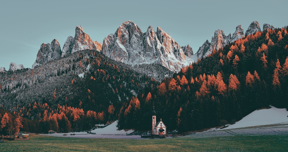 a house in front of a mountain